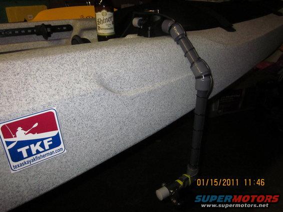 Kayak with a custom plumbing setup and a Shiner beer bottle. Date stamp reads 01/15/2011