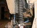 1995 Ford Bronco - Detailed view of a vehicle's suspension system, showing the coil spring and related components.