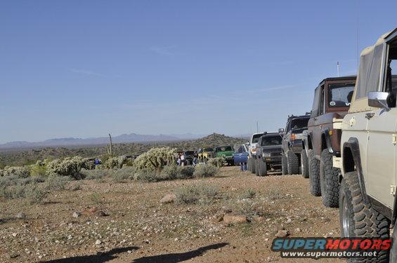 Tan 1991 Ford Bronco in a line of off-road vehicles