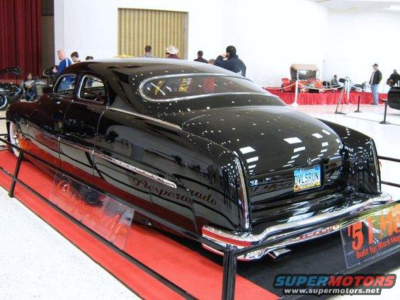 Black customized Mercury with 'Desperado' script on the side and a license plate reading 'OVLSRUN'