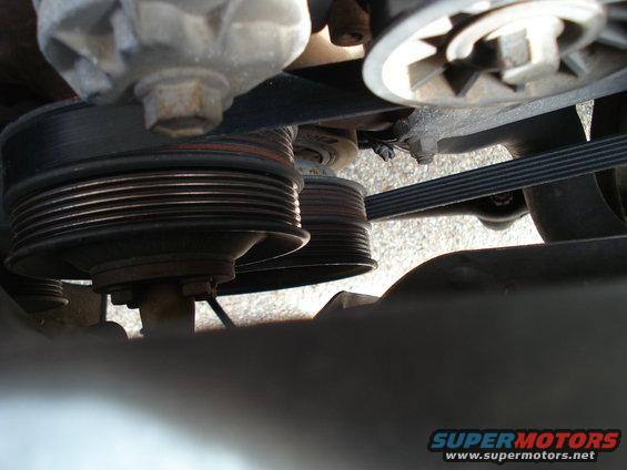Close-up of engine pulleys and serpentine belt system