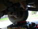 1989 Ford F-250 - Oil draining from the oil pan of a 1989 Ford F-250 during an oil change.
