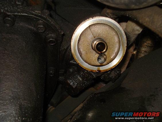 Oil filter adapter with visible oil residue