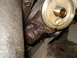 1989 Ford F-250 - Close-up of an engine's oil filter housing showing signs of oil leakage.
