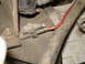 1989 Ford F-250 - A frayed red wire is visible, connected to a gray electrical plug within the engine compartment.