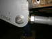 1995 Ford Bronco - This image shows a close-up of a suspension part, possibly for a roll cage, with visible text.