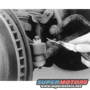 tre1.jpg Remove the cotter pin from the castellated nut at the ball stud 