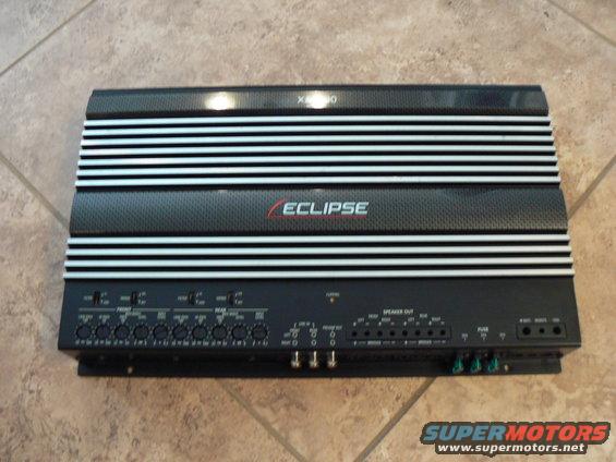 Black car amplifier with silver fins and 'ECLIPSE' logo, showing input and output terminals