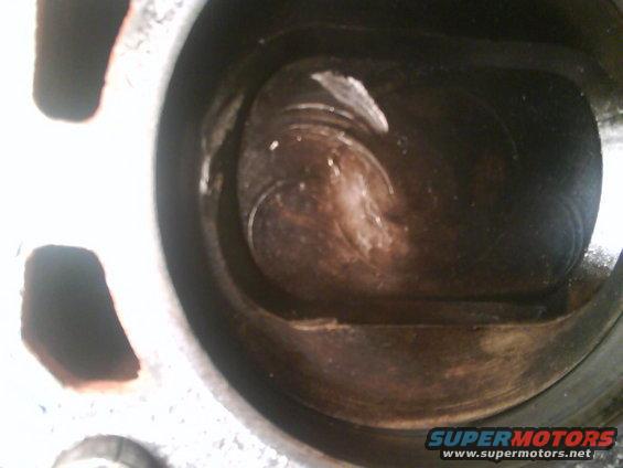 Close-up of damaged piston interior