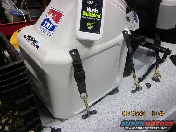 White cooler with TKF and Hook logos, attached to a kayak with straps and clips. Date stamp shows 01/18/2011