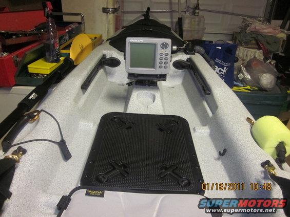 Kayak interior with fish finder and paddle