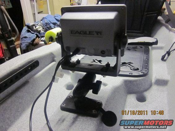 Eagle fish finder mounted on a kayak seat with cables attached