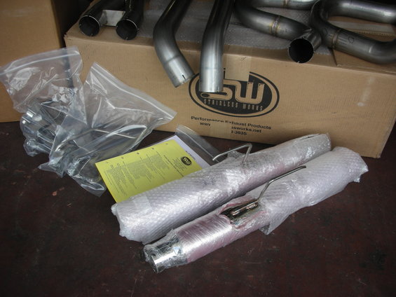 Stainless Works headers and catback exhaust system in packaging with instructions