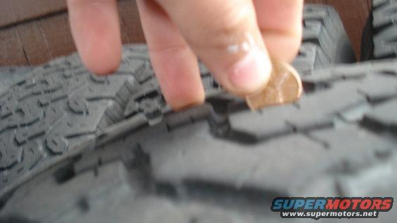 Tire tread depth measured with a penny