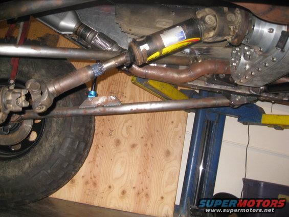 Undercarriage view of a vehicle's drive shaft and exhaust system