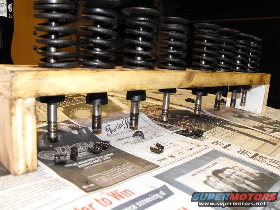The valves MUST go back into their original guide, when you're lapping. Slip the seal on the valve, underneath, in case you tip the rack over