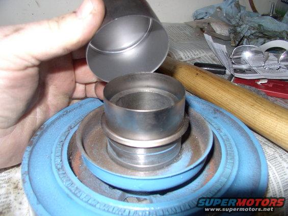 See that groove filled with paint, just below the repair sleeve ? Put back, without the sleeve it will allow oil past your new timing cover seal immediately.