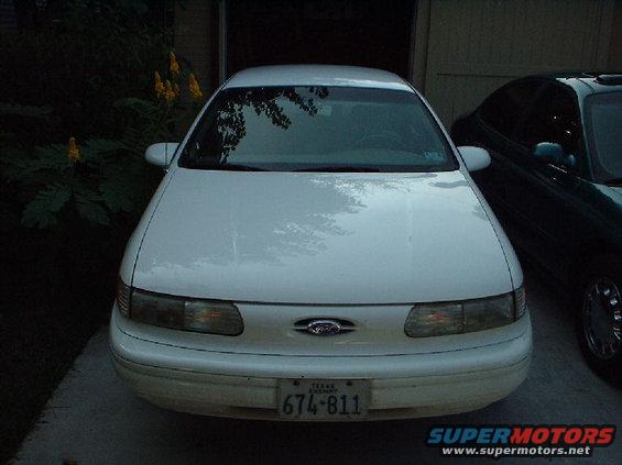 Front view of a white 1996 Ford Taurus with a Texas license plate