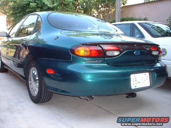 1996 Ford Taurus rear quarter panel and taillight, with another car visible behind it