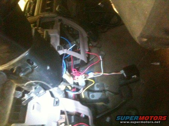 Vehicle dashboard with exposed wires and electronic components