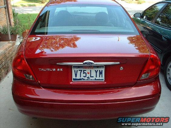 Red 1996 Ford Taurus SE rear view with Texas license plate V75-LYM