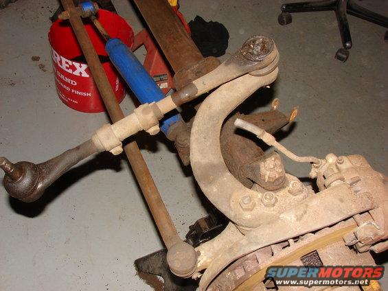 Vehicle suspension parts including tie rods and shock absorber
