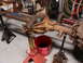 1971 International School Bus - A disassembled rear axle assembly is supported by jack stands in a workshop setting.