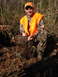 1992 Ford C-350 (Centurion Conversions) - Hunter proudly displays a wild boar after a successful hunt in a wooded area.