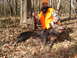 1992 Ford C-350 (Centurion Conversions) - A hunter poses with a wild boar he has successfully hunted in a wooded area.