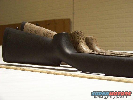 Gun stocks in black and camouflage patterns on a ruler