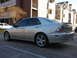 2008 Subaru Legacy - Silver sedan parked in front of apartment buildings.