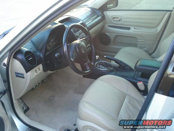Interior view of a Lexus IS300, showing dashboard, steering wheel, center console, and front seats