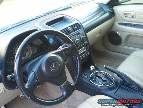 Interior shot of a Lexus IS, showing the steering wheel, dashboard, and center console with automatic shifter