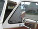 1981 Ford Bronco - The wing window of a 1981 Ford Bronco is covered in duct tape, obscuring the broken glass.