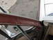 1981 Ford Bronco - Detail of the door frame and window seal on a vehicle, with exterior paint visible.