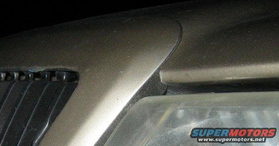 Gold 2000 Mercury Grand Marquis grille and headlight detail