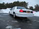 1999 Ford Crown Victoria - Rear view of a white Ford Crown Victoria sedan in a snowy environment. License plate FGV-7260 is visible.