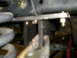 1995 Ford Bronco - This image shows a close-up view of vehicle suspension parts, including a coil spring and metal brackets.