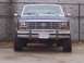 1985 Ford Bronco - Front view of a 1985 Ford Bronco, showing its distinctive grille and headlights.