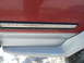 1993 Ford C-150 (Centurion Conversions) - Close-up of a truck's side trim, showing a decorative inlay and two-tone paint.