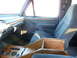 1993 Ford C-150 (Centurion Conversions) - Interior of a 1993 Ford C-150 (Centurion Conversions) with a custom wood center console and bucket seats.