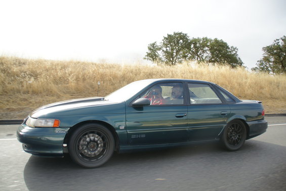 1995 Ford Taurus sedan, side view, dark green