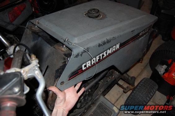 Gray Craftsman riding mower hood with red stripe and text