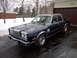 1983 Chrysler Fifth Avenue - A dark blue 1983 Chrysler Fifth Avenue sedan with a vinyl roof is parked in a driveway on a snowy day.