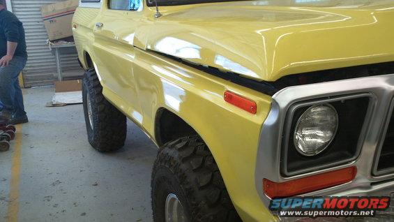 Yellow 1978 Ford Bronco front quarter view with large tires