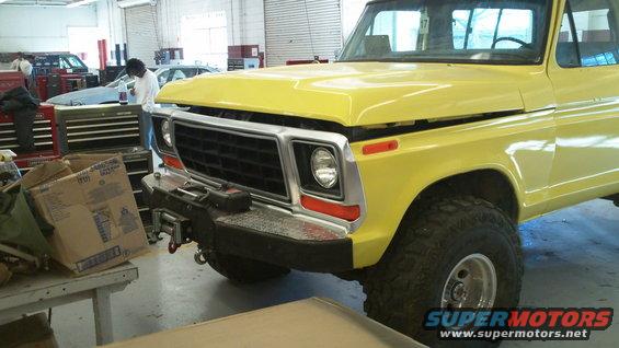Yellow 1978 Ford Bronco with aftermarket bumper and winch