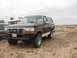 1992 Ford Bronco - This 1992 Ford Bronco is shown from the front three-quarter view in an outdoor setting.