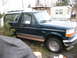 1995 Ford Bronco - This Ford Bronco is parked in a yard with a trailer home in the background.