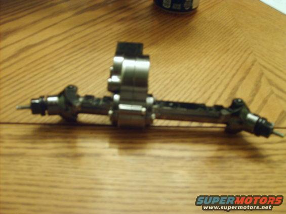 RC car axle assembly on wooden table