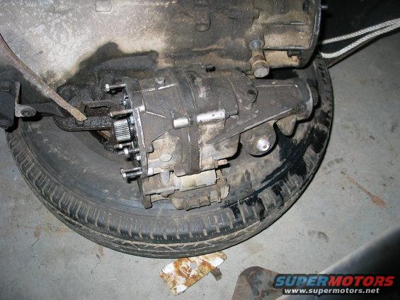 Transfer case assembly resting on a spare tire